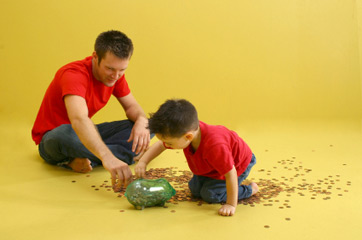 Father and son counting pennies