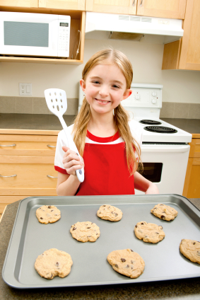 little girl baking cookies